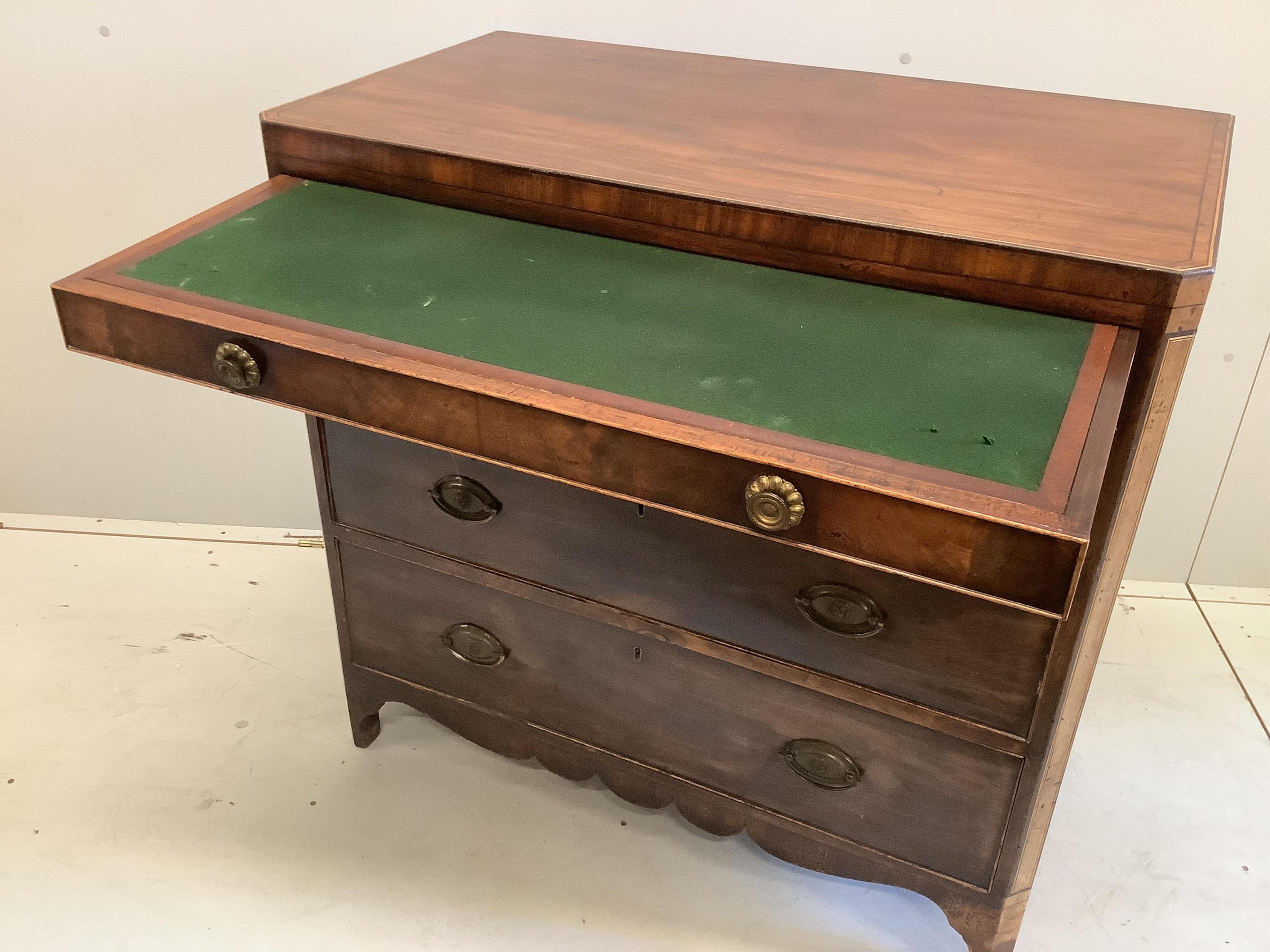 A George IV banded mahogany dressing chest, the fitted drawer with baize lined sliding surface and adjustable easel mirror, width 95cm, depth 51cm, height 92cm. Condition - fair